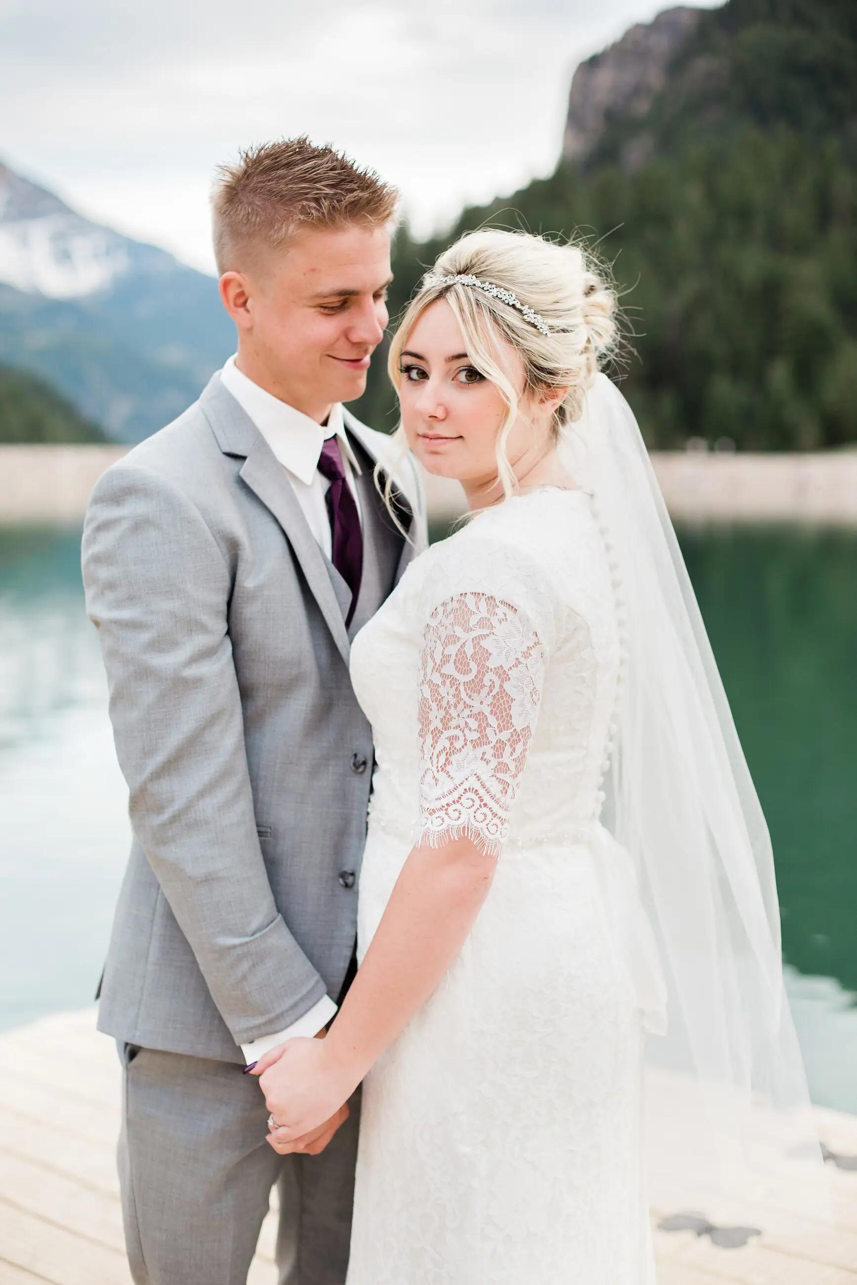 Сouple wearing a white gown and a grey suit